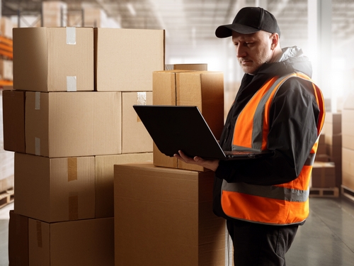 Businessman,In,Warehouse.,Distribution,Center,Supervisor.,Businessman,Near,Cardboard,Boxes.